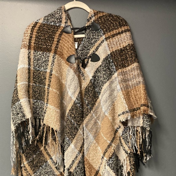 Sweaters - 💛TODAY***$16***Designer poncho with two black button and hook closures at top.